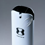 Skincare product with 'ONE SKIN' branding on a gray background