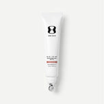 Tube of One Skin sunscreen on a light beige background