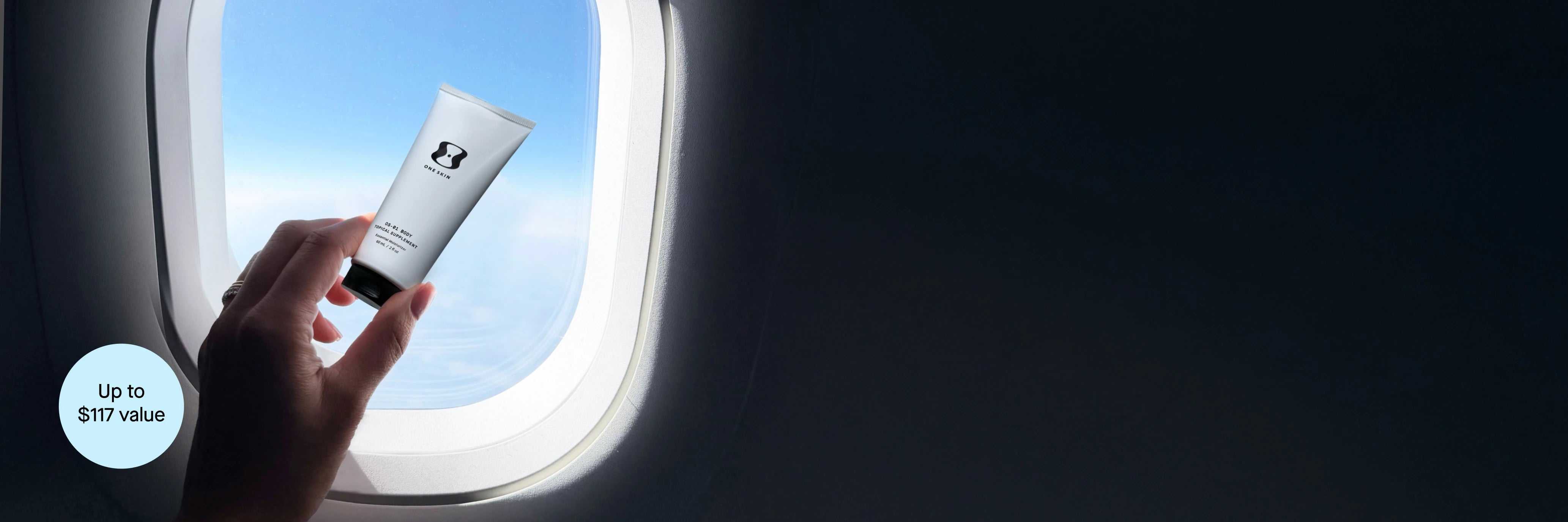 Hand holding a skincare product near an airplane window with blue sky outside with a circle containing text that states Up to $117 value