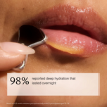 Close-up of glossy lips with a silver lip product applicator being pulled outward by a hand, plus a text overlay reading '98% reported deep hydration that lasted overnight'.