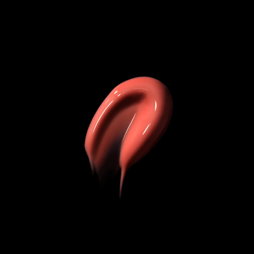 Blush swipe of cosmetic product on a black background