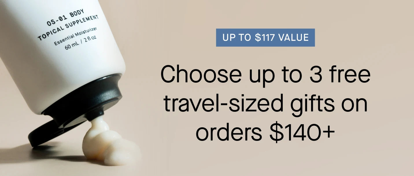 OneSkin OS-01 Body Topical Supplement bottle tipped on its side dispensing a dollop of moisturizer. Promotional text: "Up to $117 value — Choose up to 3 free travel-sized gifts on orders $140+."