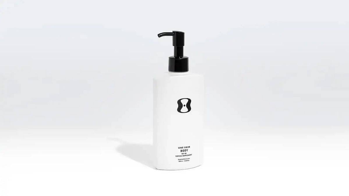 White bottle with black pump on a white background