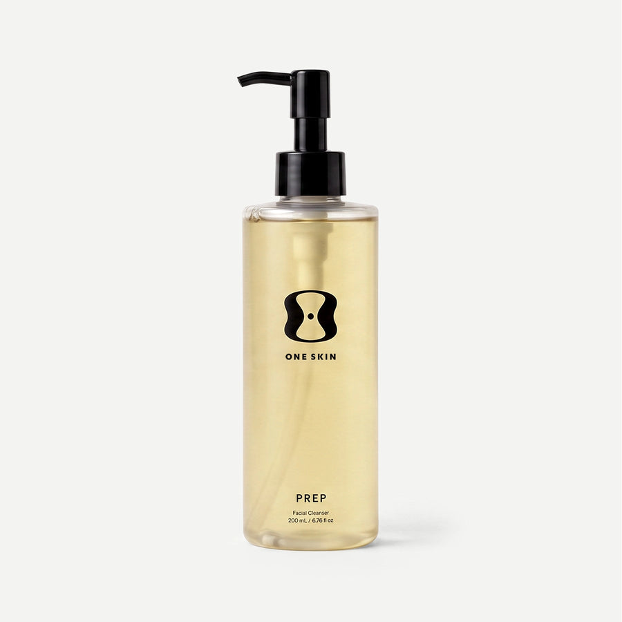 Bottle of 'One Skin' Prep on a beige background