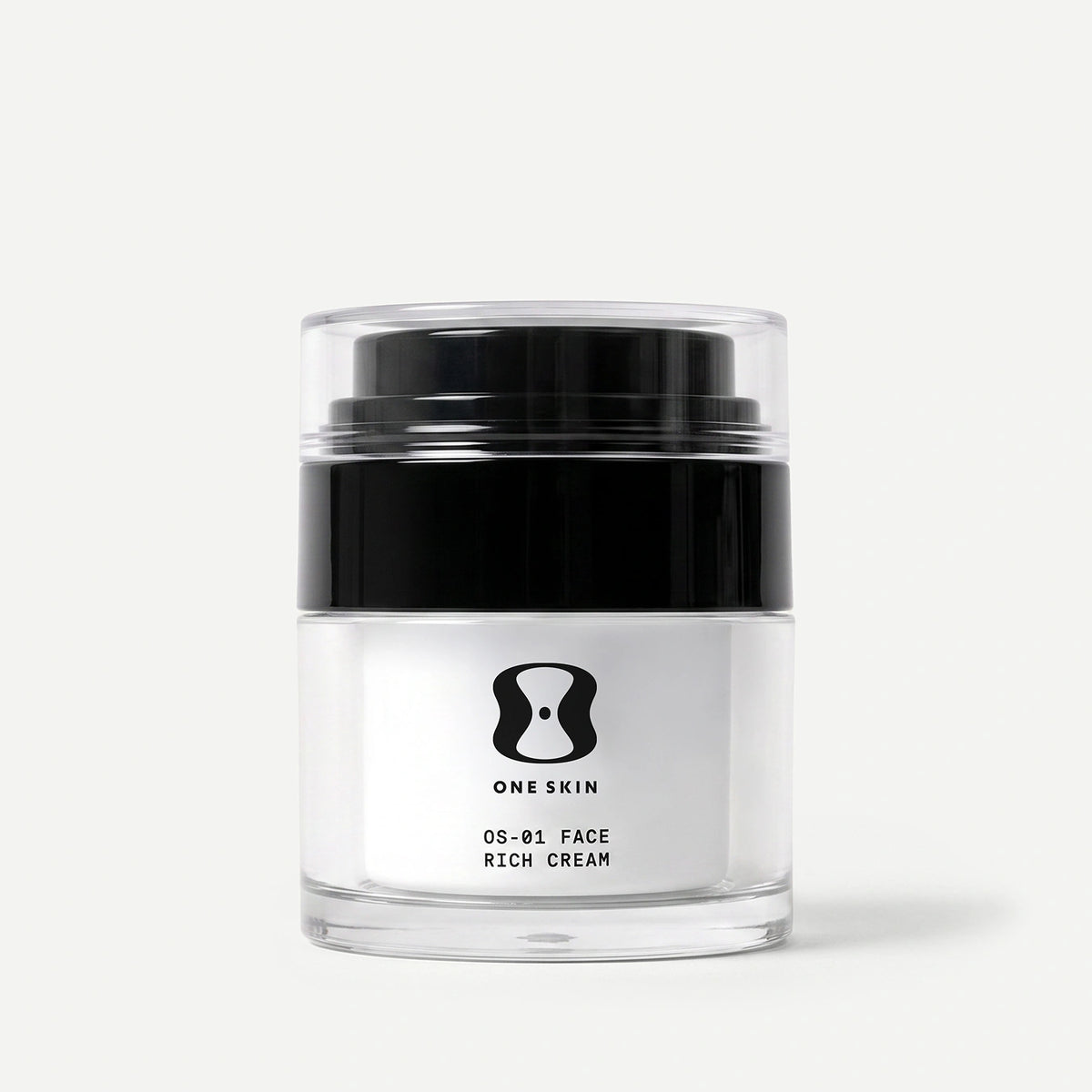 A clear cosmetic jar of ONE SKIN 05-01 Face Rich Cream with a black lid and white label, set against a clean light gray background.