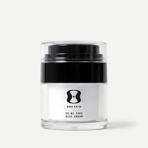 A clear cosmetic jar of ONE SKIN 05-01 Face Rich Cream with a black lid and white label, set against a clean light gray background.