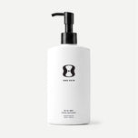 White bottle with black pump and 'One Skin' logo on a beige background