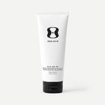 Tube of One Skin body SPF cream on a beige background