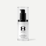 Clear bottle with black pump and 'One Skin' label on a light beige background