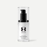 Clear bottle with black pump and 'One Skin' label on a light beige background