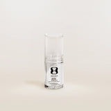 Clear glass supplement bottle with a label on a white background