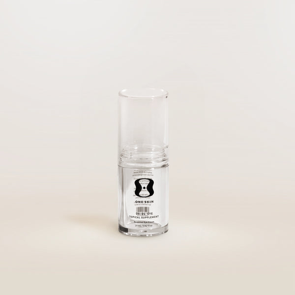 Clear glass supplement bottle with a label on a white background