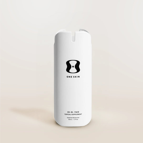 White supplement bottle labeled 'One Skin' on a beige background