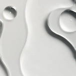 Close-up of water droplets on a reflective surface