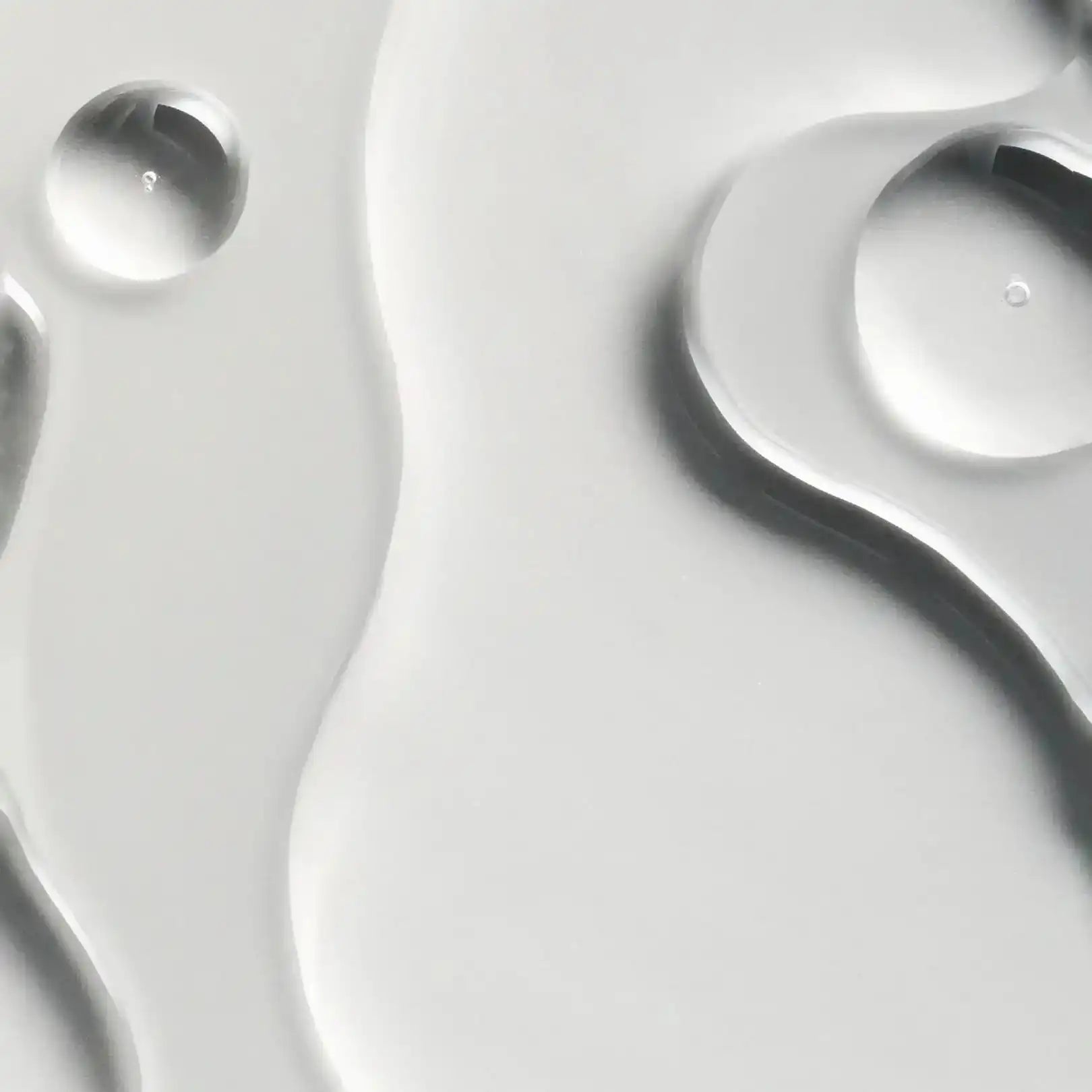 Close-up of water droplets on a reflective surface