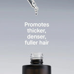 Hair product dropper with text promoting thicker, denser, fuller hair on a gray background