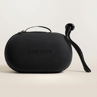 Black carrying case and black dermaroller with 'ONE SKIN' branding on a beige background