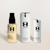 Three skincare products from the brand 'One Skin' on a light background