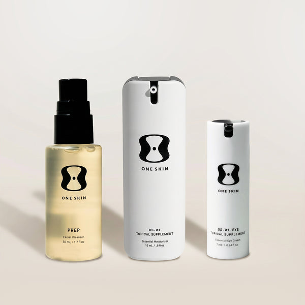 Three skincare products from the brand 'One Skin' on a light background