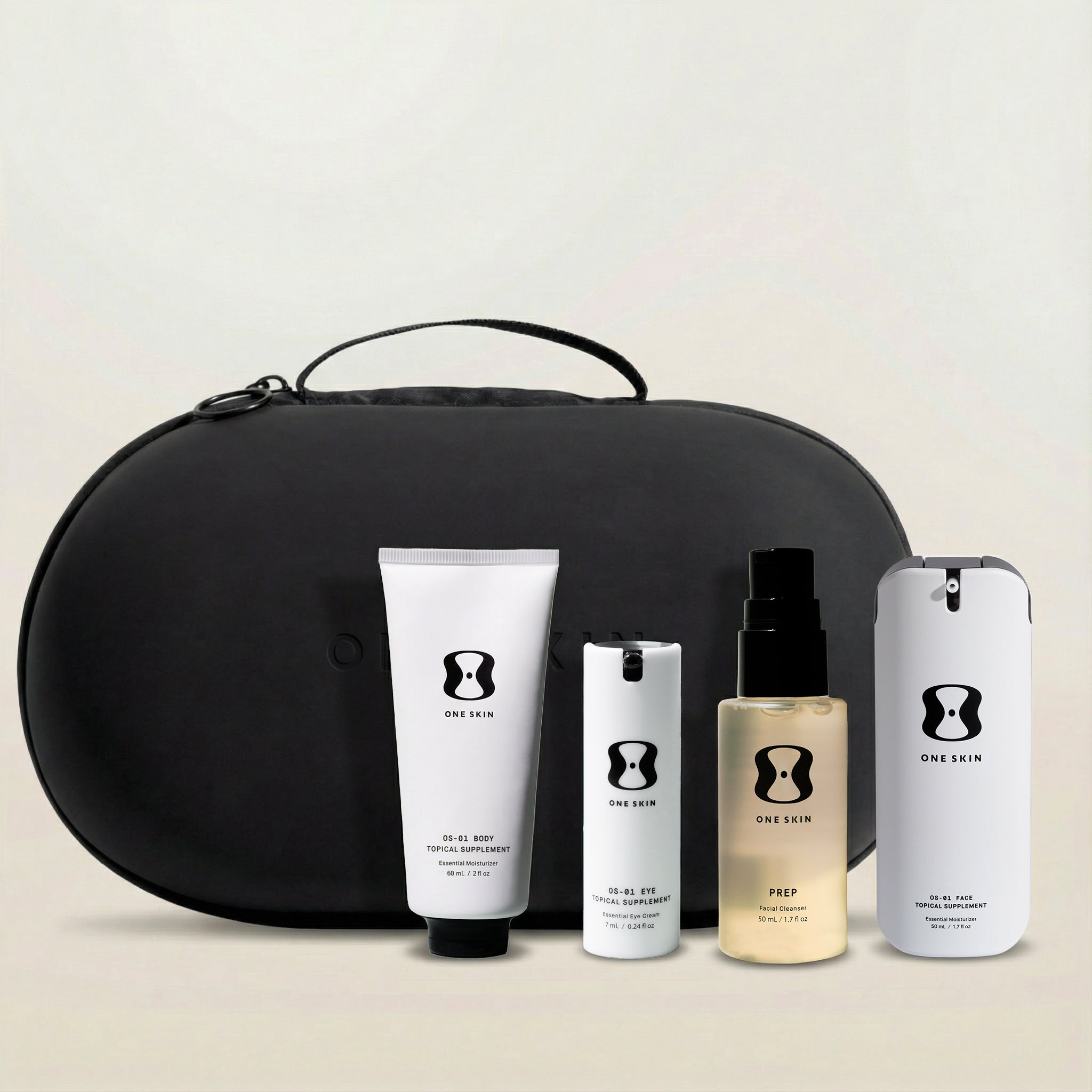 Set of skincare products with a black travel case on a light background