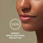Close-up of a person's face with a focus on lips, featuring text about mineral broad-spectrum protection.