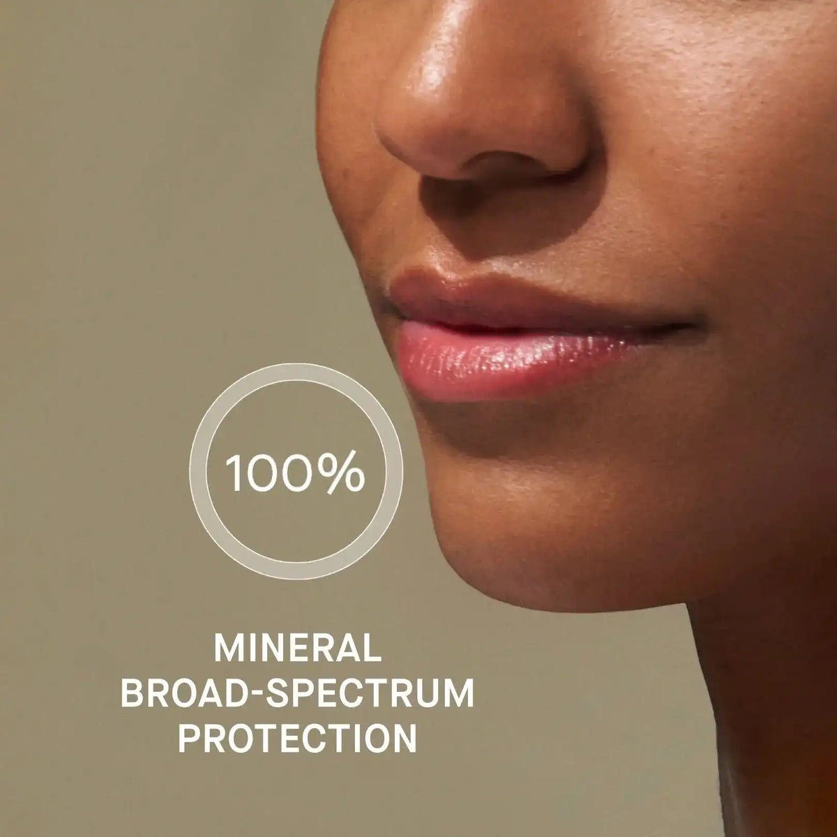 Close-up of a person's face with a focus on lips, featuring text about mineral broad-spectrum protection.